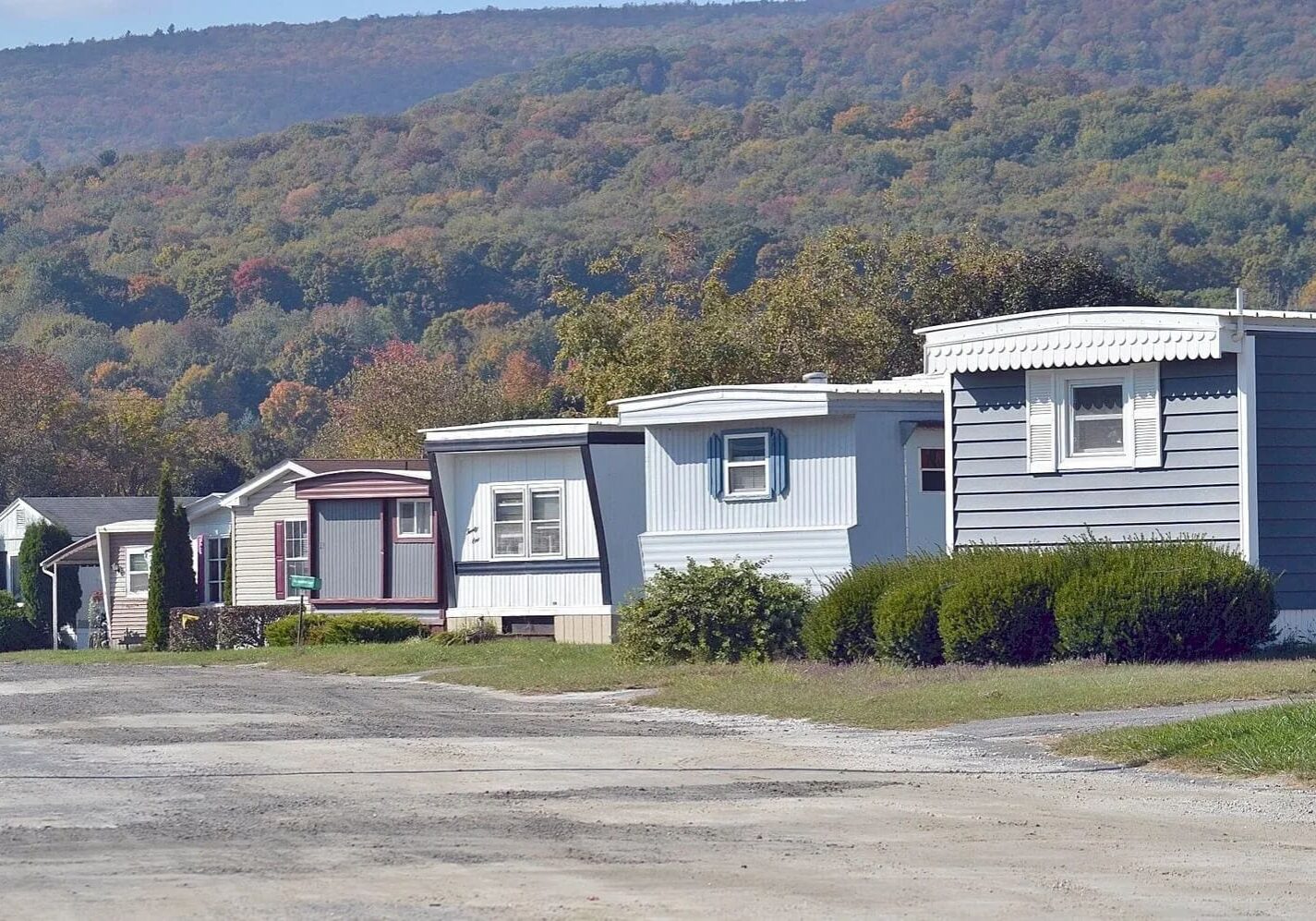 A row of mobile homes in the middle of nowhere.